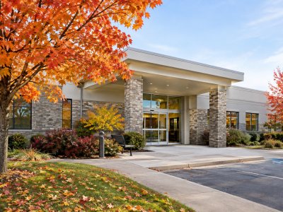 Autumn landscape with medical clinic exterior
